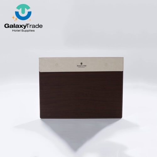 A Shangri-La branded luxury hotel writing pad featuring a beige leather magnetic header and a dark wood-grain patterned base.