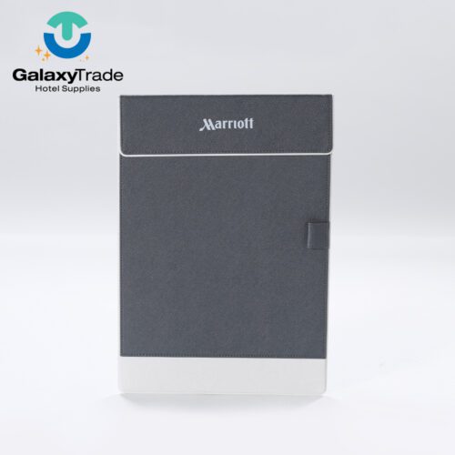 A Marriott Shanghai Luwan branded luxury hotel clipboard in grey faux leather with a white base and a pen loop.