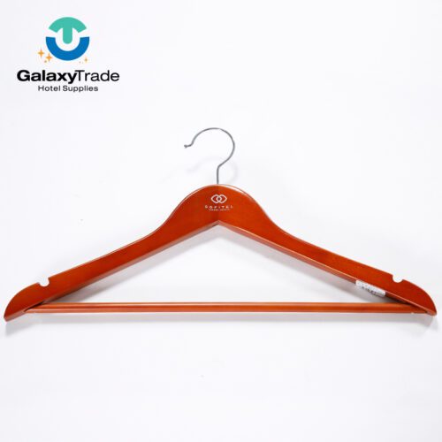 A professional shot of a single Premium Sofitel Branded Solid Wood Hotel Hanger with a glossy cherry finish.