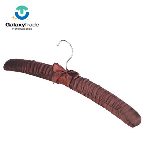 A professional product shot of a single luxury padded garment hanger covered in coffee brown ruched satin with a decorative satin bow.