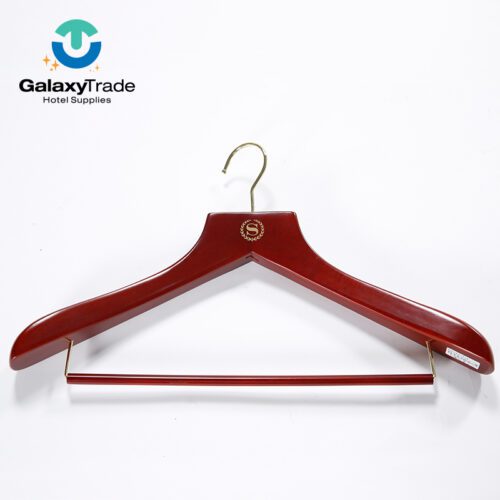 A high-end Custom Sheraton Branded Solid Wood Suit Hanger in mahogany finish with a gold trouser bar.