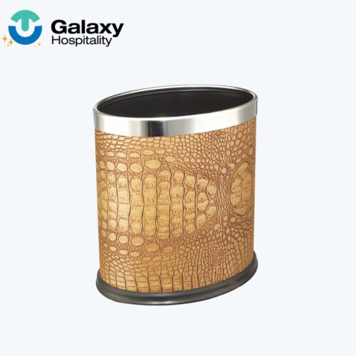 A professional shot of an Oval Faux Crocodile Leather Waste Basket featuring a light brown animal-print texture and a silver metallic rim.