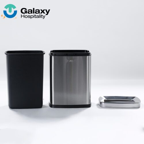 A professional exploded-view shot of a Brushed Stainless Steel Waste Basket components: black inner liner, silver outer casing, and top lid.