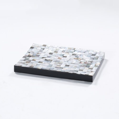 A professional studio photograph of a rectangular Natural Shell Inlay Soap Dish featuring an iridescent mosaic surface and a solid black base.