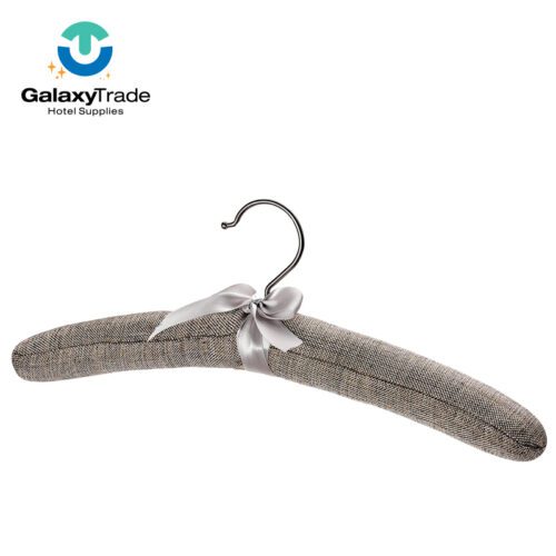 A professional product shot of a single luxury padded garment hanger covered in grey linen fabric with a decorative satin bow.