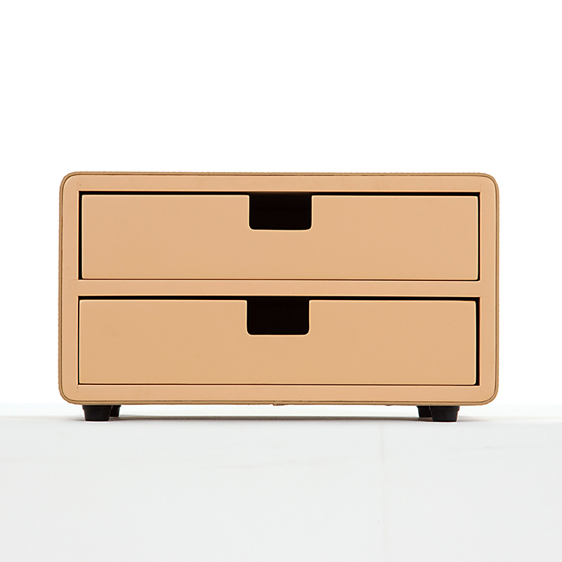 A front-facing professional product shot of a Kempinski branded beige faux leather double-drawer organizer unit with black non-slip feet.