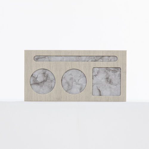 A Sheraton branded luxury hotel desk organizer featuring a grey linen-textured frame and marble-patterned compartment inlays.