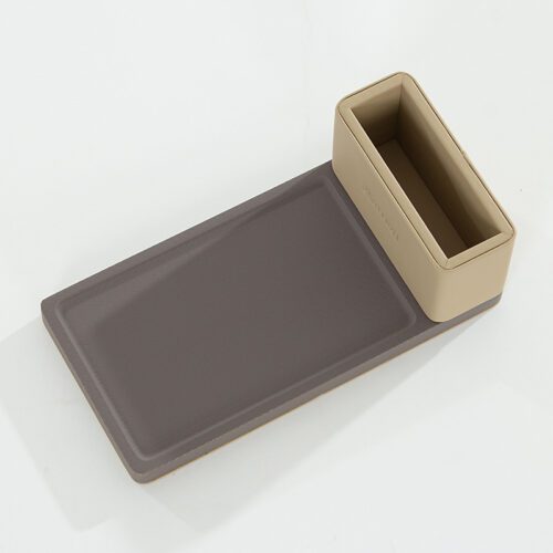 A professional product shot of a Marriott branded beige faux leather notepad holder with a dark grey textured vertical accent on the right.
