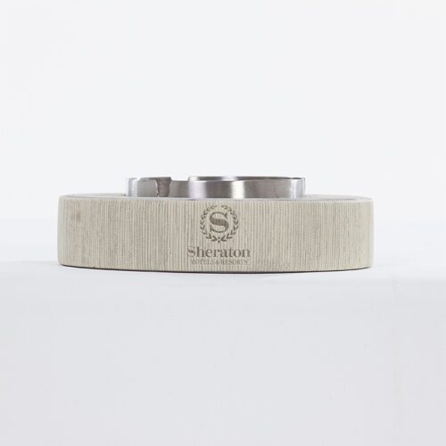 A Sheraton branded luxury hotel ashtray base featuring a grey linen-textured faux leather wrap and a stainless steel insert.