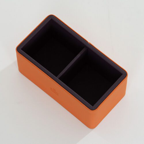 A Braira branded vibrant orange faux leather rectangular organizer tray with two compartments and a deep purple interior.