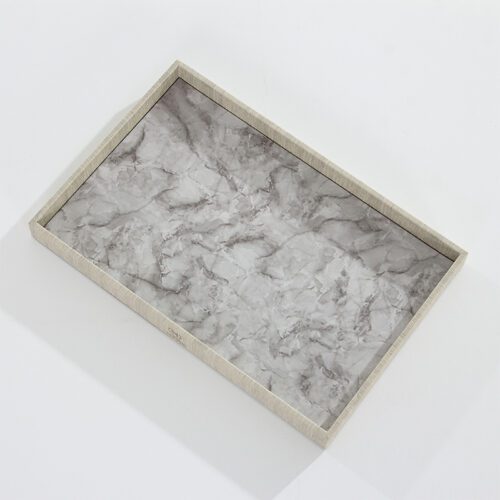 A Sheraton branded luxury hotel amenity tray featuring a grey marble-textured base and a linen-textured leather rim.