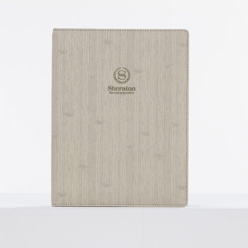A Sheraton branded luxury guest room folder featuring a grey marble-textured leather body and gold debossed logo.