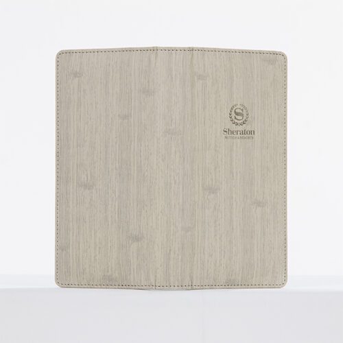 A Sheraton branded luxury restaurant bill presenter featuring a grey linen-textured leather exterior and precision stitching.