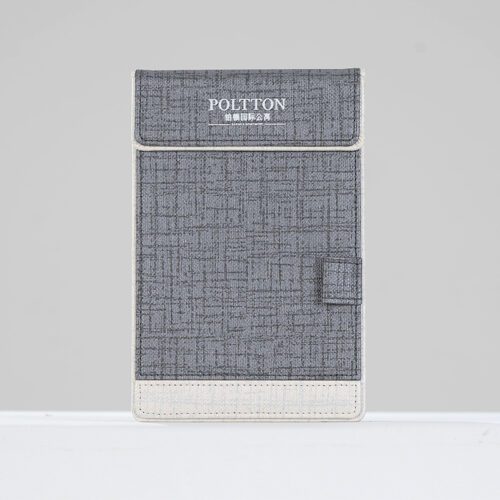 A professional product shot of a POLTTON branded grey linen-textured faux leather notepad holder with an integrated pen loop.