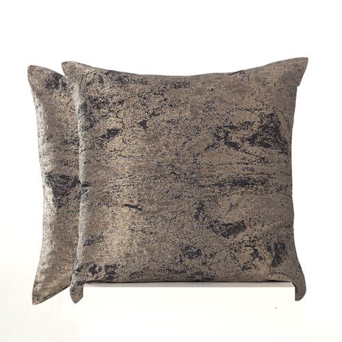 A pair of high-end throw pillows featuring a distressed bronze and charcoal abstract metallic texture.