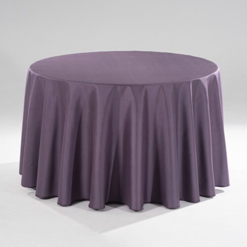 A large purple round polyester tablecloth with a subtle raindrop jacquard pattern draped over a banquet table in a professional setting.