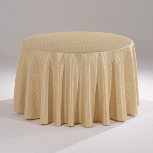 A large gold round polyester tablecloth with an intricate cross-grid jacquard pattern draped over a banquet table.