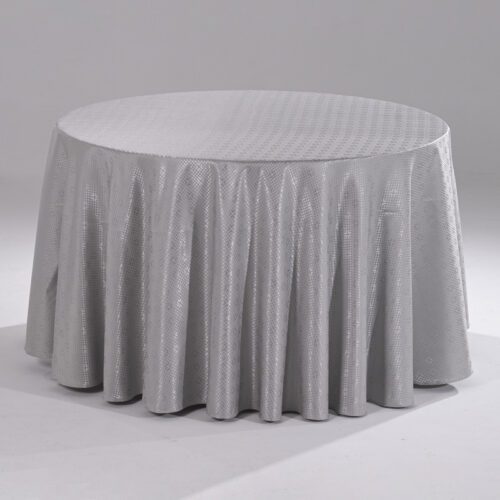 A large silver grey round polyester tablecloth with an intricate grid jacquard pattern draped over a banquet table.
