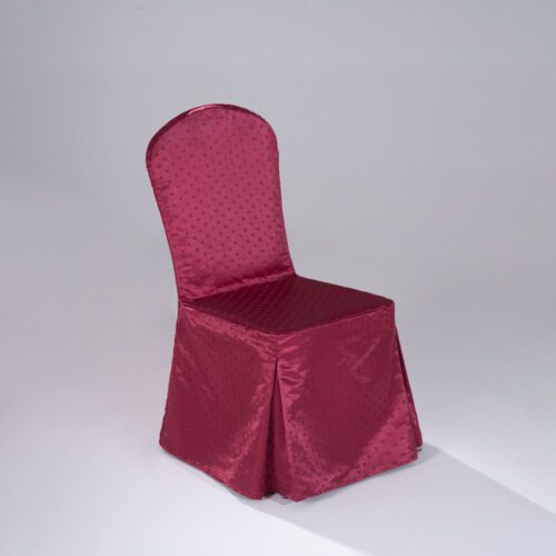 A formal wine red banquet chair covered in a custom-fit polyester slipcover featuring a subtle "Small Snowflake" jacquard pattern.