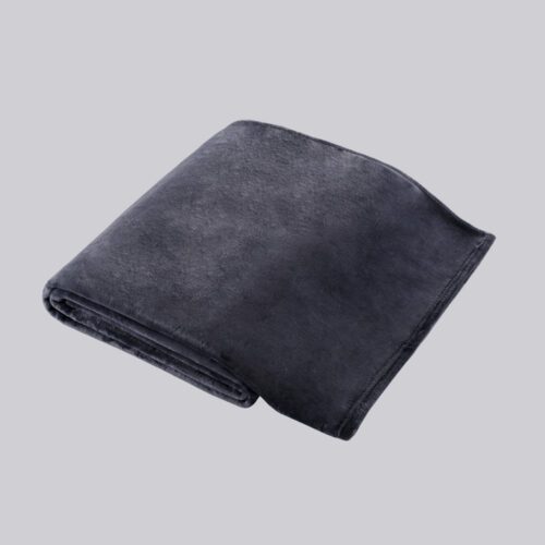 A neatly folded deep grey ultra-soft polyester fleece blanket for hotel use.