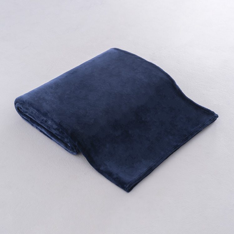 A neatly folded navy blue 100% polyester fleece blanket for professional hotel use.