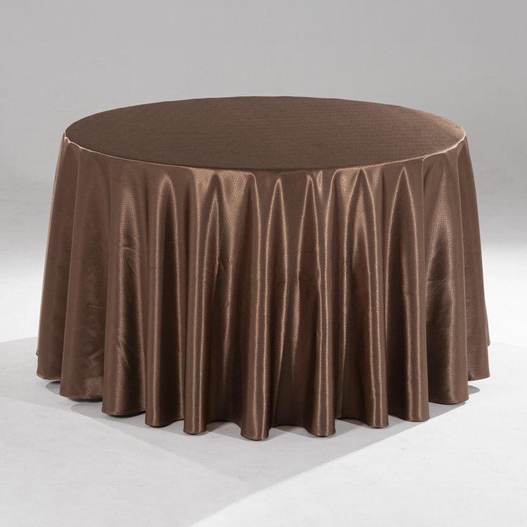 A large coffee brown round polyester tablecloth with a subtle raindrop jacquard pattern draped over a banquet table in a professional setting.