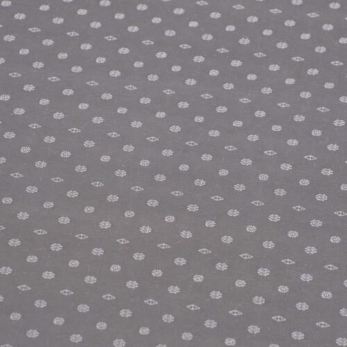Close-up view of the shimmering silver jacquard weave showing the elegant "Snowflake" floral pattern.