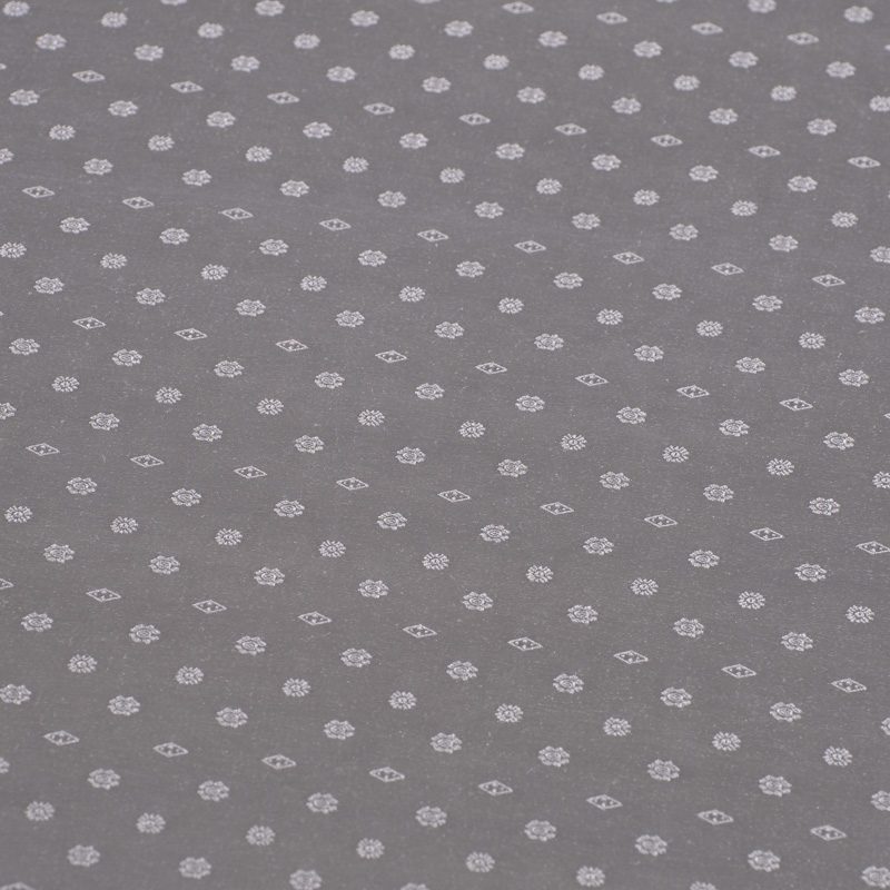 Close-up view of the shimmering silver jacquard weave showing the elegant "Snowflake" floral pattern.