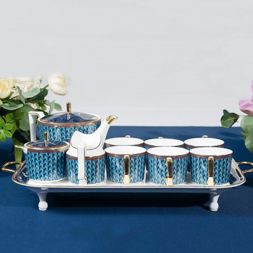 A complete 9-piece luxury porcelain tea set featuring a blue 3D geometric motif and gold handles on a white serving tray.