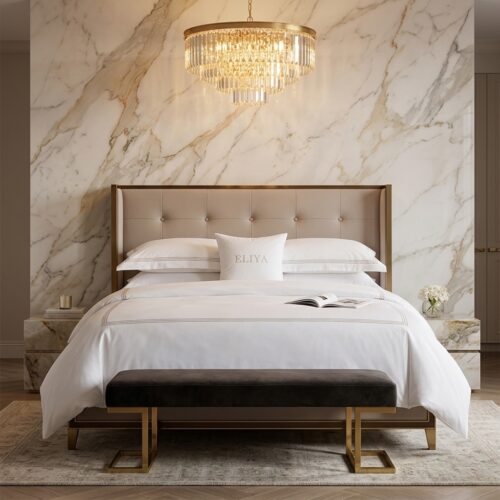 ELIYA luxury white hotel bedding set with cotton sateen duvet cover, flat sheet and pillow shams styled on a king bed with tufted beige headboard against a gold-veined marble wall under a crystal chandelier