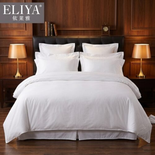 ELIYA premium hotel king bed dressed in crisp white sateen linens with stacked Oxford pillow shams against a dark walnut wood wall paneling background.