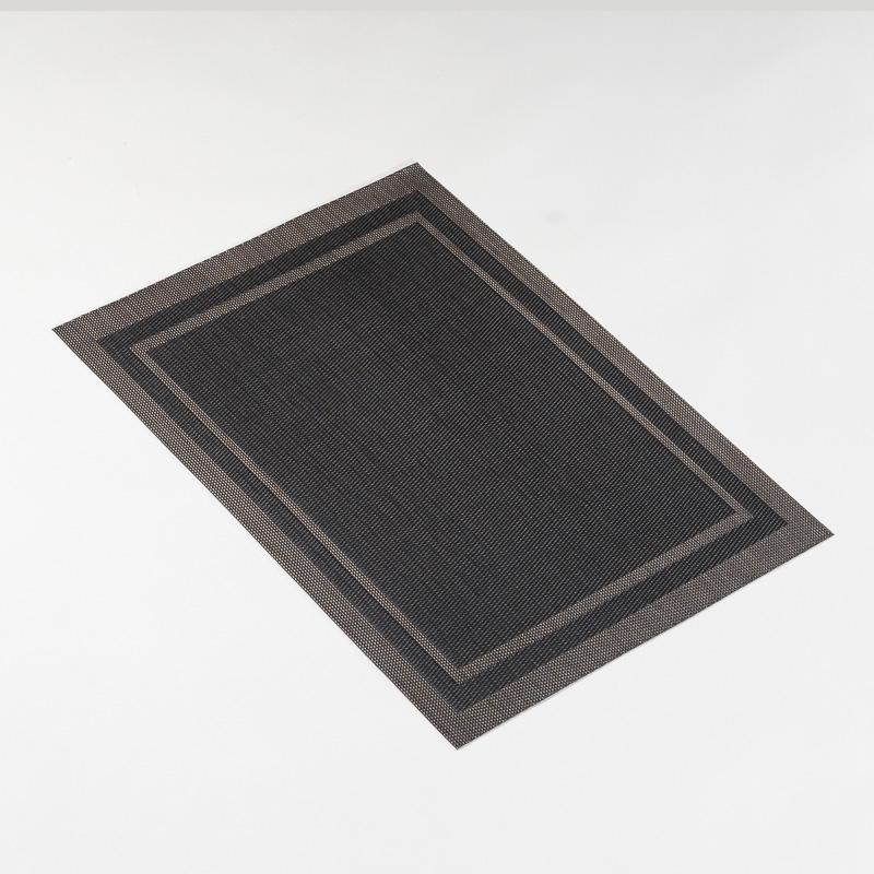 Galaxy premium charcoal black and bronze double-bordered rectangular woven placemat lying flat on a light grey background.