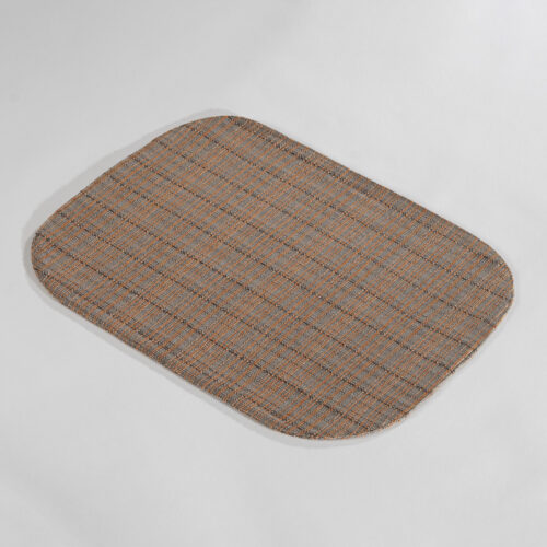 Galaxy premium amber brown oval textured woven placemat showing rounded corner profile on a light grey background.