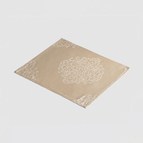 Galaxy premium apricot jacquard polyester placemat with cream oriental medallion pattern on a light grey background.