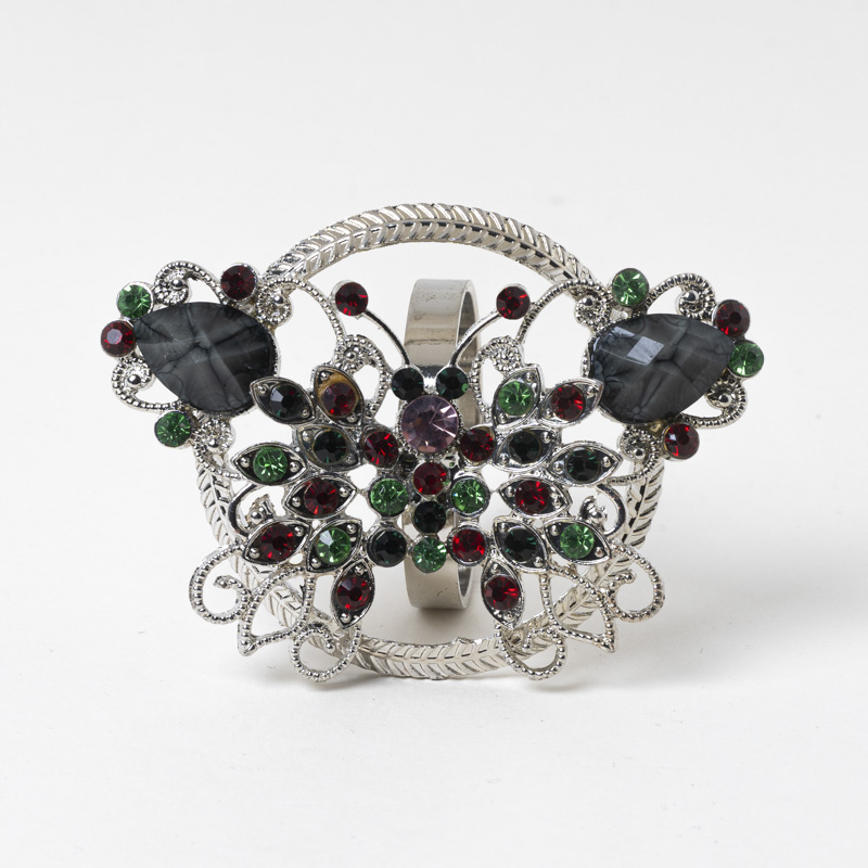 Galaxy vintage jeweled butterfly napkin ring holder with red green crystal rhinestones on a white background.