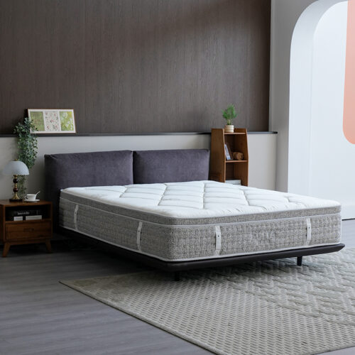 Galaxy premium euro-top pocket spring hotel mattress on a dark wooden bed frame in a modern suite.