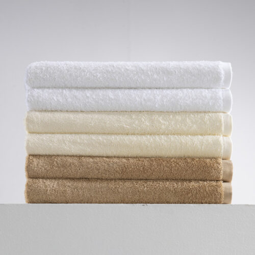 Galaxy premium 100% combed cotton stacked hotel bath towels in white, cream ivory, and camel brown.