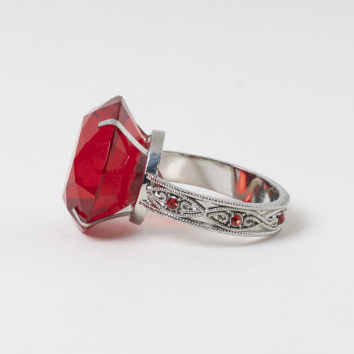 Galaxy luxury ruby red gem napkin ring holder in a solitaire ring design on a white background.