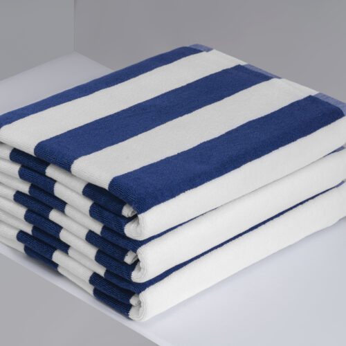 Stack of navy blue and white striped commercial pool towels.