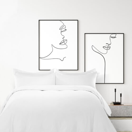 Crisp white hotel bed made with a plain weave cotton duvet cover, sheet, and Oxford flange pillow shams.