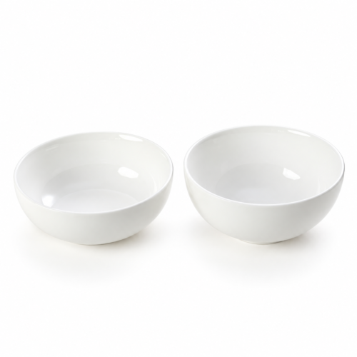 Two pure white high-gloss ceramic hotel bowls including a shallow pasta bowl and a deep cereal bowl on a white background.